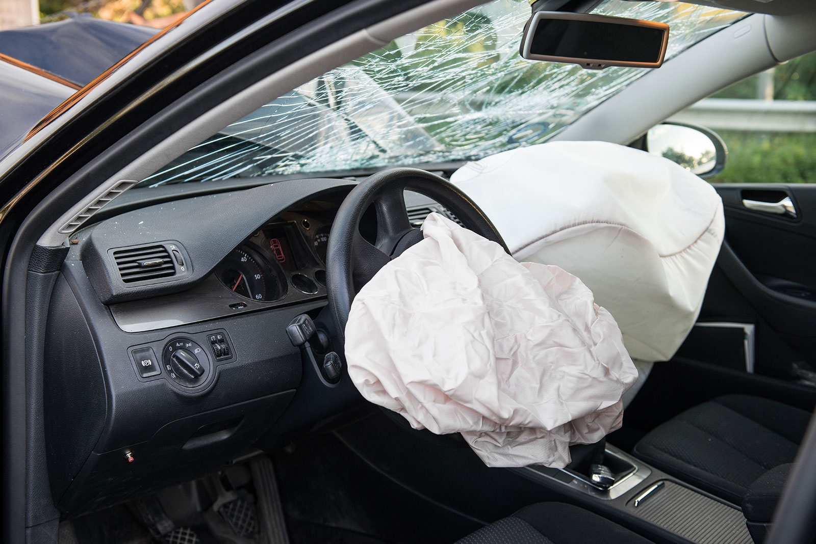 Ontario auto insurance policy document next to car keys