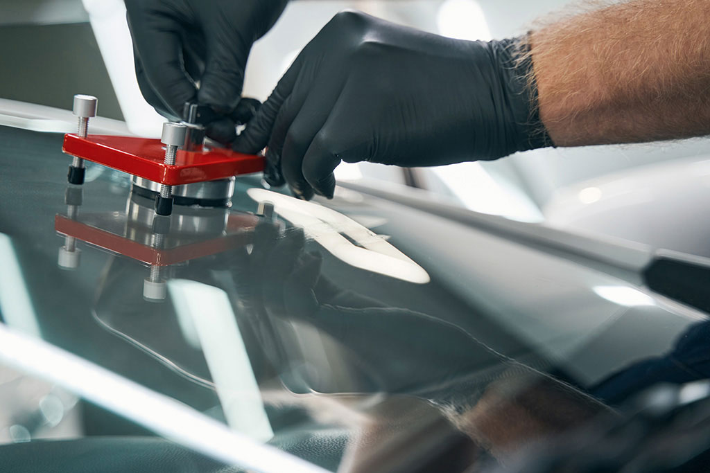 Close-up of a rock chip on a windshield before repair
